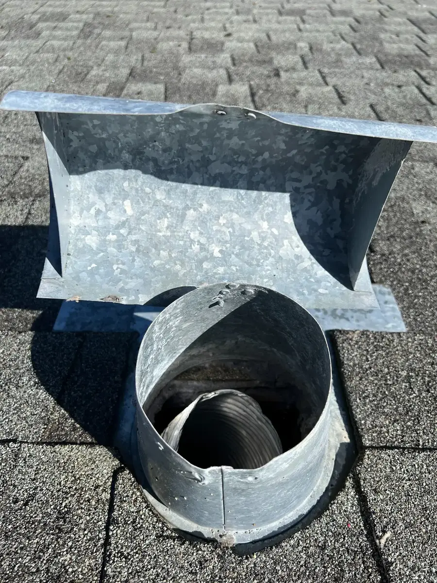 Dryer vent outlet after compacted lint was professionally removed